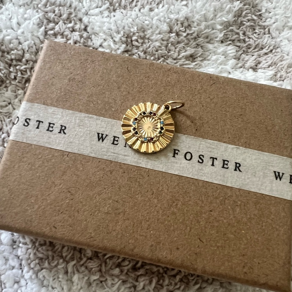 Gold necklace charm
